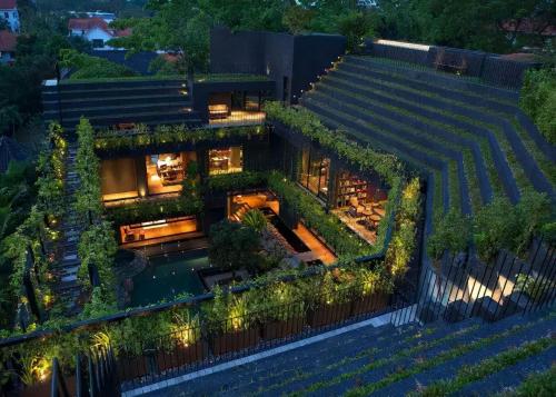 Vertical blocks and interlocking layouts, these tropical luxury homes represent a realm of harmony between man and nature.
