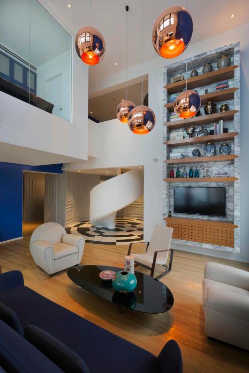 The duplex apartment is decorated in form of a Disney castle, blue color is so cartoony.
